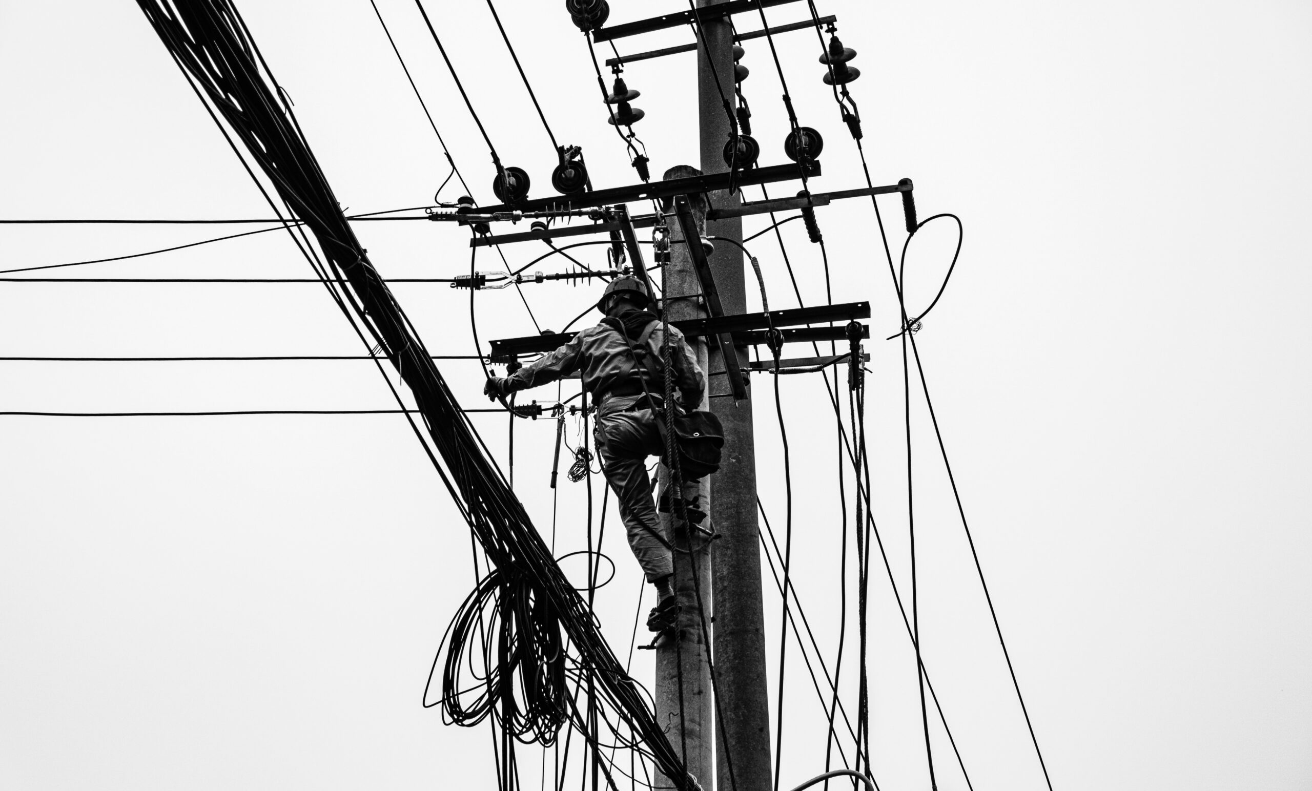 Voltage Sag vs Interruption: Causes, Impact, and Fixes A plant can lose a production line from a blink of power, even when the lights come back almost at once. If you've seen a VFD trip, a contactor drop out, or a PLC reset after a split-second dip, you've seen power quality turn into a production problem. The issue is often not a full outage. It's a short voltage event that sensitive equipment can't ride through. Start with the basics, and the failure starts to make sense. What voltage sag and interruption mean A voltage sag is a short drop in RMS voltage below normal, usually to 10% to 90% of rated voltage, for 0.5 cycles up to 1 minute. In a 415 V system, a brief drop to 280 V or 250 V is a sag, not a blackout. Duration matters. If voltage stays low for more than a minute, that is usually undervoltage, not sag. A sag arrives fast, recovers fast, and can still stop a machine. This quick comparison makes the difference easier to see: EventWhat happensTypical durationVoltage sagVoltage drops but does not go to zero0.5 cycles to 1 minuteVoltage interruptionVoltage is zero or near zeroLess than 1 minuteUndervoltageVoltage stays below normal for longerMore than 1 minute An interruption is more severe because supply is lost completely, or almost completely, for less than a minute. If it clears in a few seconds after auto-reclosing, it is a momentary interruption. If it stays off beyond a minute, it becomes a sustained interruption. Why these events happen The most common cause is a fault on the power system. That could be a single line-to-ground fault, line-to-line fault, double line-to-ground fault, or a three-phase fault. When fault current rises, voltage drops across the network until protection clears the problem. If the fault is on your feeder, you may see a sag first and then an interruption when the breaker opens. If the fault is on another feeder from the same substation, your breaker may never trip, but your plant can still see a bus voltage dip. That is why equipment can trip even when "our feeder never opened." Large motor starting is another frequent cause. An induction motor can draw five to seven times full-load current during start. In a weak system, or where the motor is large compared with the transformer, that inrush can create a temporary sag. Transformer energization, capacitor switching, welding loads, arc furnaces, and sudden heavy loading can do the same. Why a tiny dip can stop a large machine > The main motor may ride through a sag, but the control power often won't. Older plants had more electromechanical loads, and many of them tolerated short dips. Modern plants rely on PLCs, VFDs, servo drives, electronic power supplies, sensors, relays, and SCADA. Those devices make automation possible, but many are more sensitive to voltage dips than the motor they control. Massive steel control panels and heavy machinery dominate the floor as overhead lights cast a chaotic, flickering glow. Sharp shadows and sparks suggest a sudden surge in the facility power grid. [https://user-images.rightblogger.com/ai/f382171e-d1b1-4320-b7eb-289d9b53ee27/industrial-factory-power-instability-93e17dc7.jpg] A short sag may not stop a spinning motor because inertia keeps it moving. Still, the contactor coil can drop out, the VFD can detect undervoltage, and the PLC power supply can reset. Once the control chain breaks, the process stops. In process plants, that can mean lost batches, reset time, scrap, labor loss, and delayed delivery. Magnitude and duration both matter. Some equipment can tolerate 80% voltage for five cycles, but not 40% for the same time. That is why ride-through curves matter, and why event recording matters too. Good monitoring tools, such as monitoring power quality with PME 2024 R2 [https://www.interestingautomation.com/schneider-pme-2024-r2/], help capture minimum voltage, duration, and affected phases. Practical ways to reduce voltage sag problems The most cost-effective fix starts with the weak point. If a 200 kW machine trips because a 230 V PLC supply resets, you usually do not need to protect the whole machine. You need to protect the control power. * Specify ride-through performance when buying critical PLCs, drives, relays, and controls. * Add a small UPS, DC backup, or capacitor ride-through module for control power. * Use a voltage sag compensator or dynamic voltage restorer for sensitive process loads. * Apply online UPS systems where transfer time cannot be tolerated. * Consider motor-generator or flywheel systems where short interruptions happen often. * Use static transfer switches only when the two sources are truly independent. Source quality matters too. Utilities reduce events with better protection coordination, faster fault clearing, line maintenance, tree trimming, and feeder automation. On the plant side, grid automation and fault visibility also help, which is why tools for using Easergy T300 for fault detection [https://www.interestingautomation.com/brief-explain-easergy-t300-features-benefits-and-complete-guide/] are relevant in systems that need faster disturbance response. Final thoughts A blink in voltage can do more damage to production than a short outage, because the failure often happens inside the control system before anyone sees a breaker trip. That is the core lesson behind voltage sag and interruption studies. The best fix is rarely the biggest one. Find what actually trips, measure how deep and how long the event lasts, and protect the most sensitive part first. A brief dip should not turn into hours of downtime.